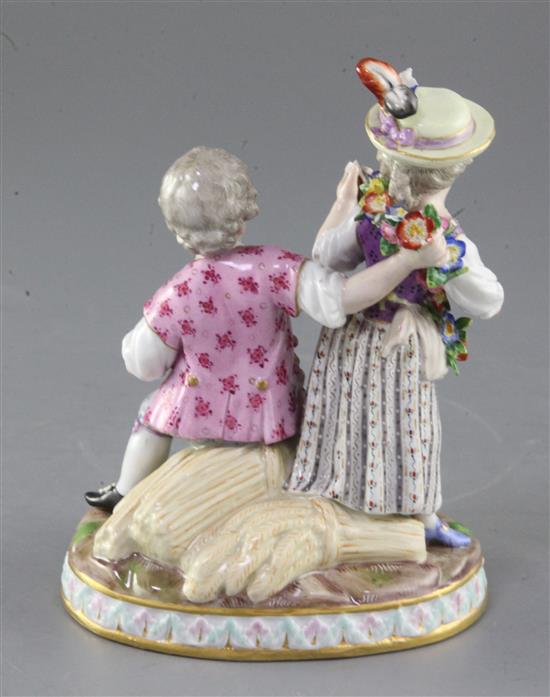 A Meissen group of a young couple, late 19th century, height 15.5cm, losses